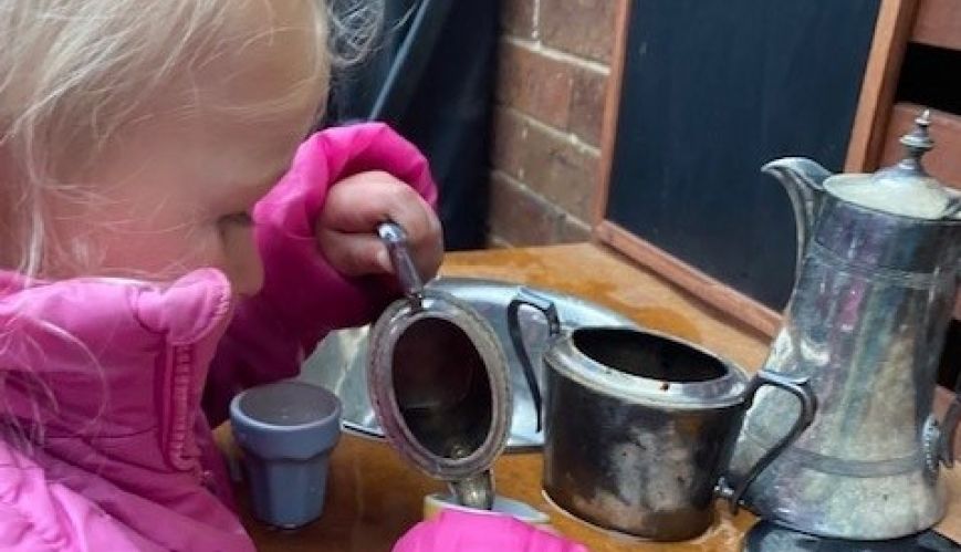 The joys of pouring pretend tea from Grandma's silverware