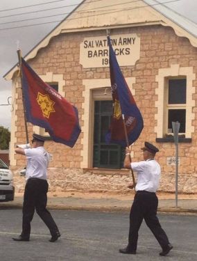 Melbourne Staff Band walk past the oriignal Salvation army barracks on the Copper Coast